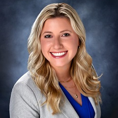 Emily Juranas of Treasury Management in a suit Emily Juranas of Treasury Management in a suit