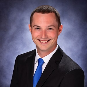 Headshot of Commercial Loan Officer Dalton Day in a suit and tie