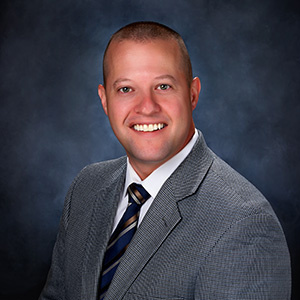 Eric McGuire in a suit and tie Eric McGuire in a suit and tie