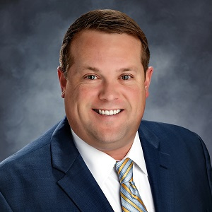 Adam O'Sullivan of Commerical Lending in a suit and tie Adam O'Sullivan of Commerical Lending in a suit and tie